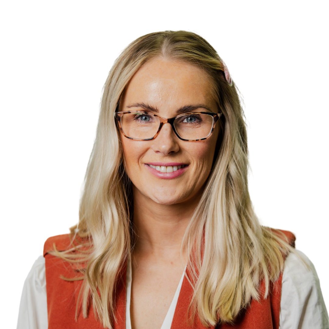 Claire has long blonde hair, glasses and is wearing a a long white shite and orange vest.