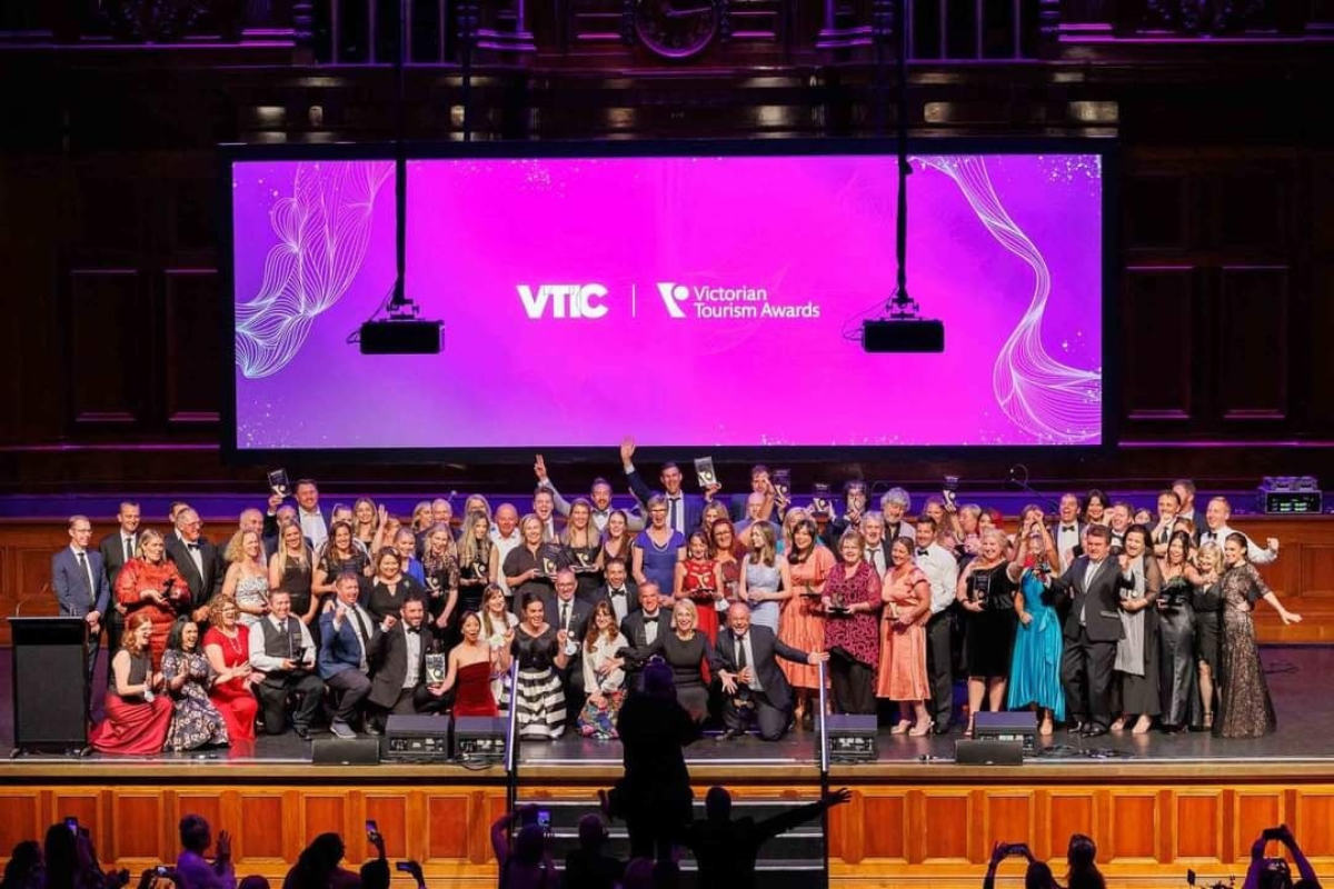 A group photo taken onstage at the Victorian Tourism Awards in 2021, featuring award winners.