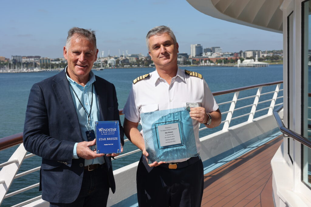 Cr Murrihy presents a plaque to Captain Pedro Montes Pinto on board the Star Breeze.